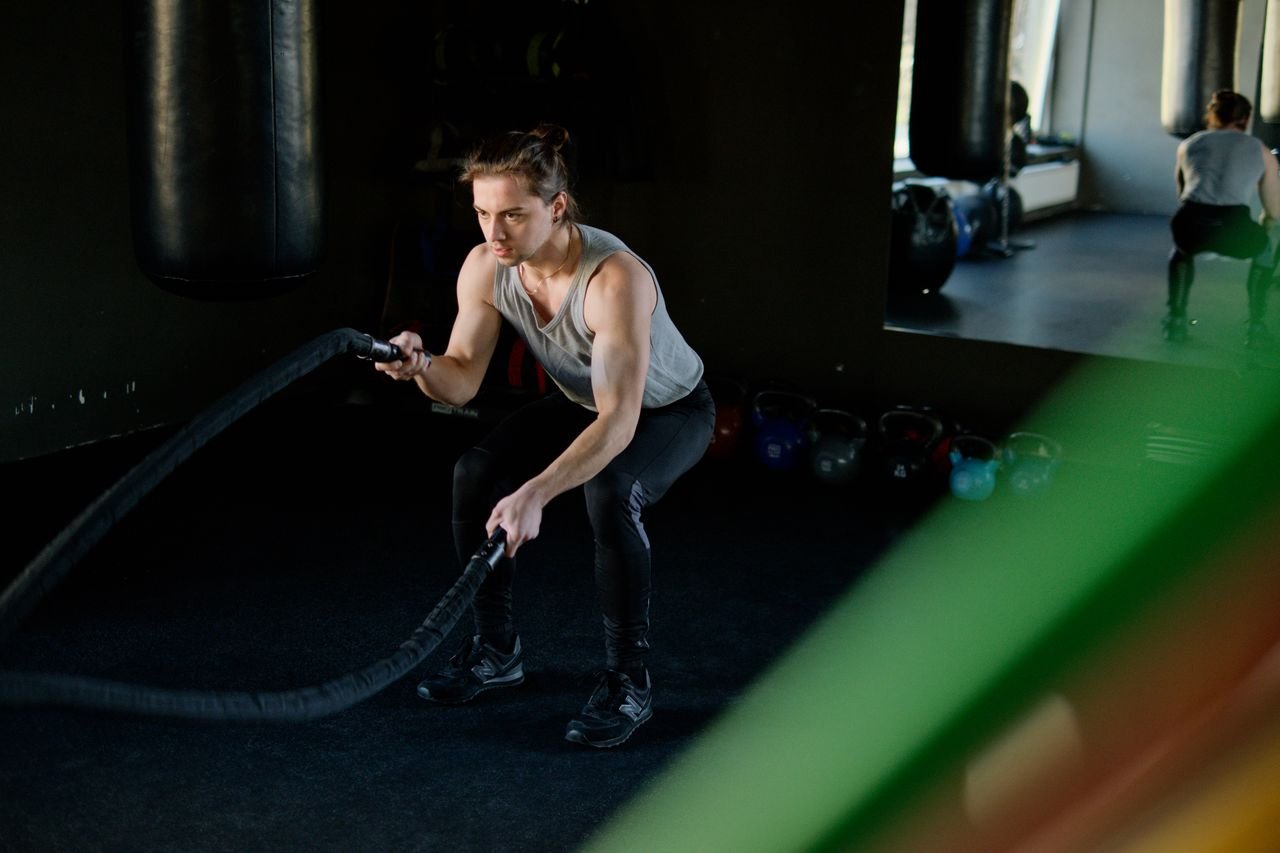 Athlete building capacity with battle ropes