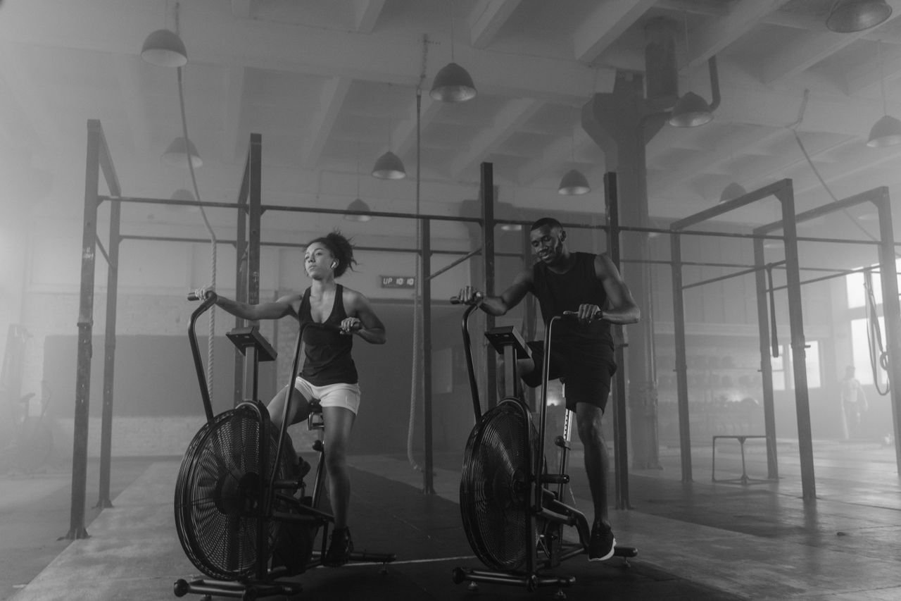 Athletes conditioning on air bikes