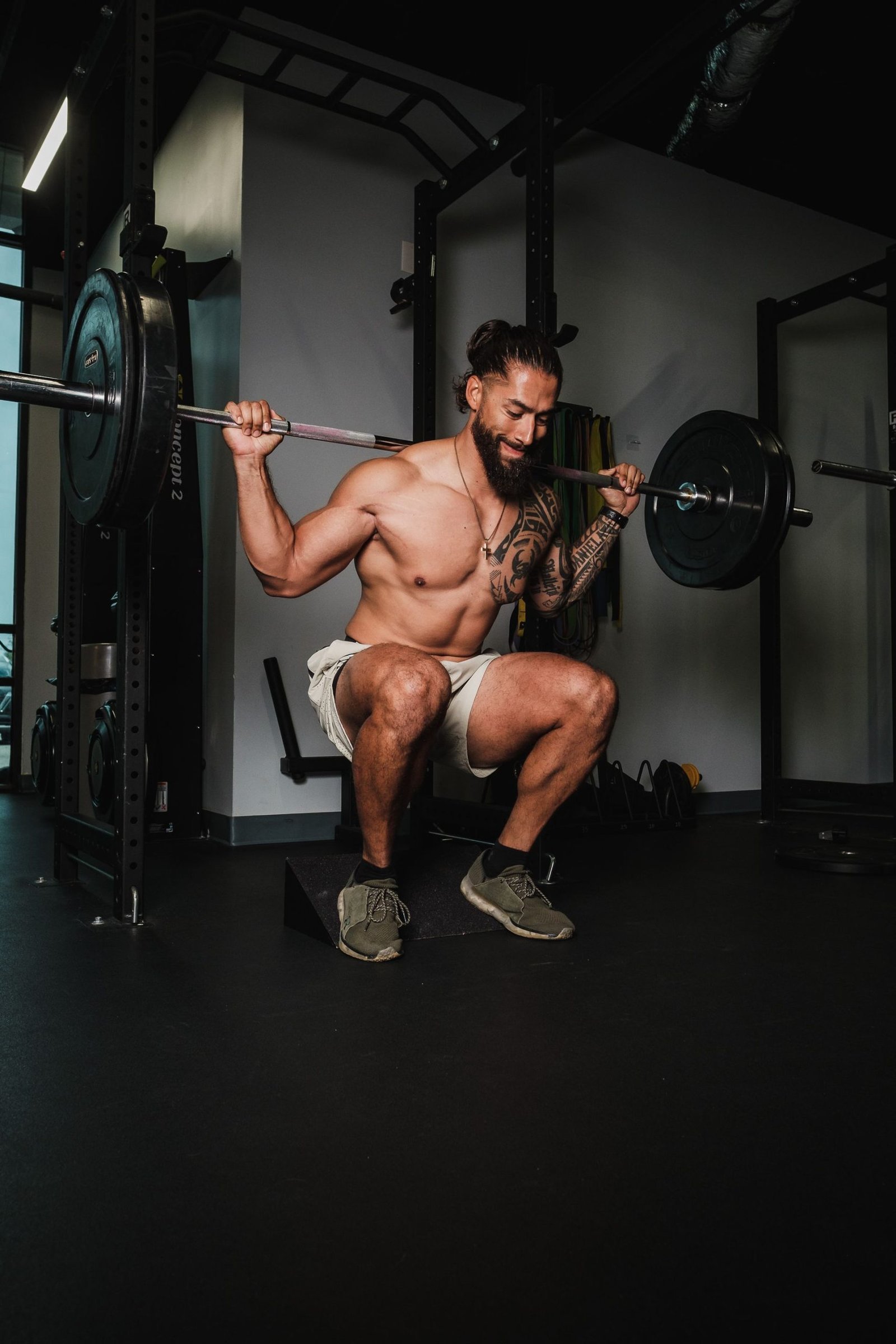 Athlete performing a controlled barbell squat